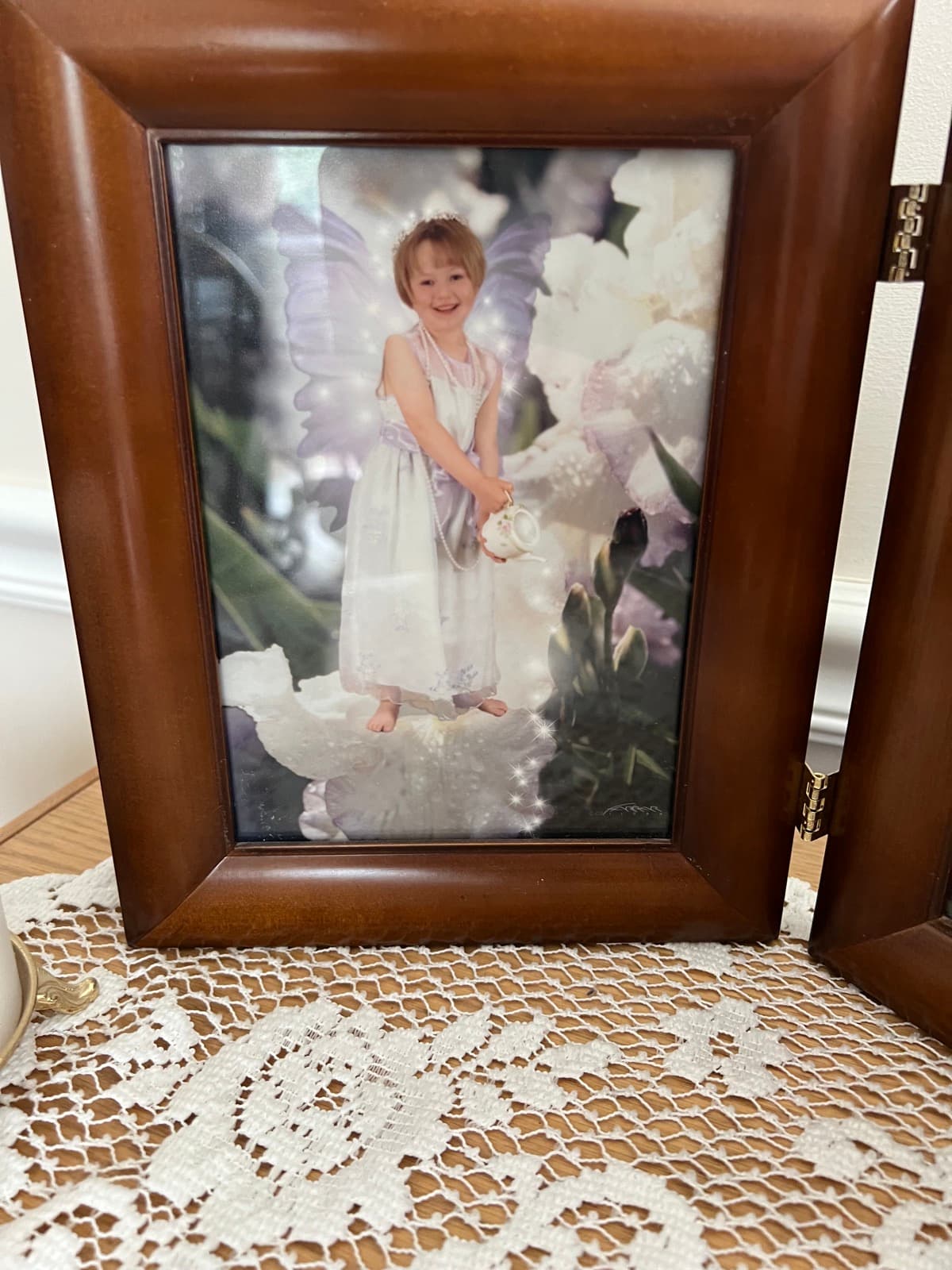 Fine art print of a child among vibrant flowers and soft morning light
